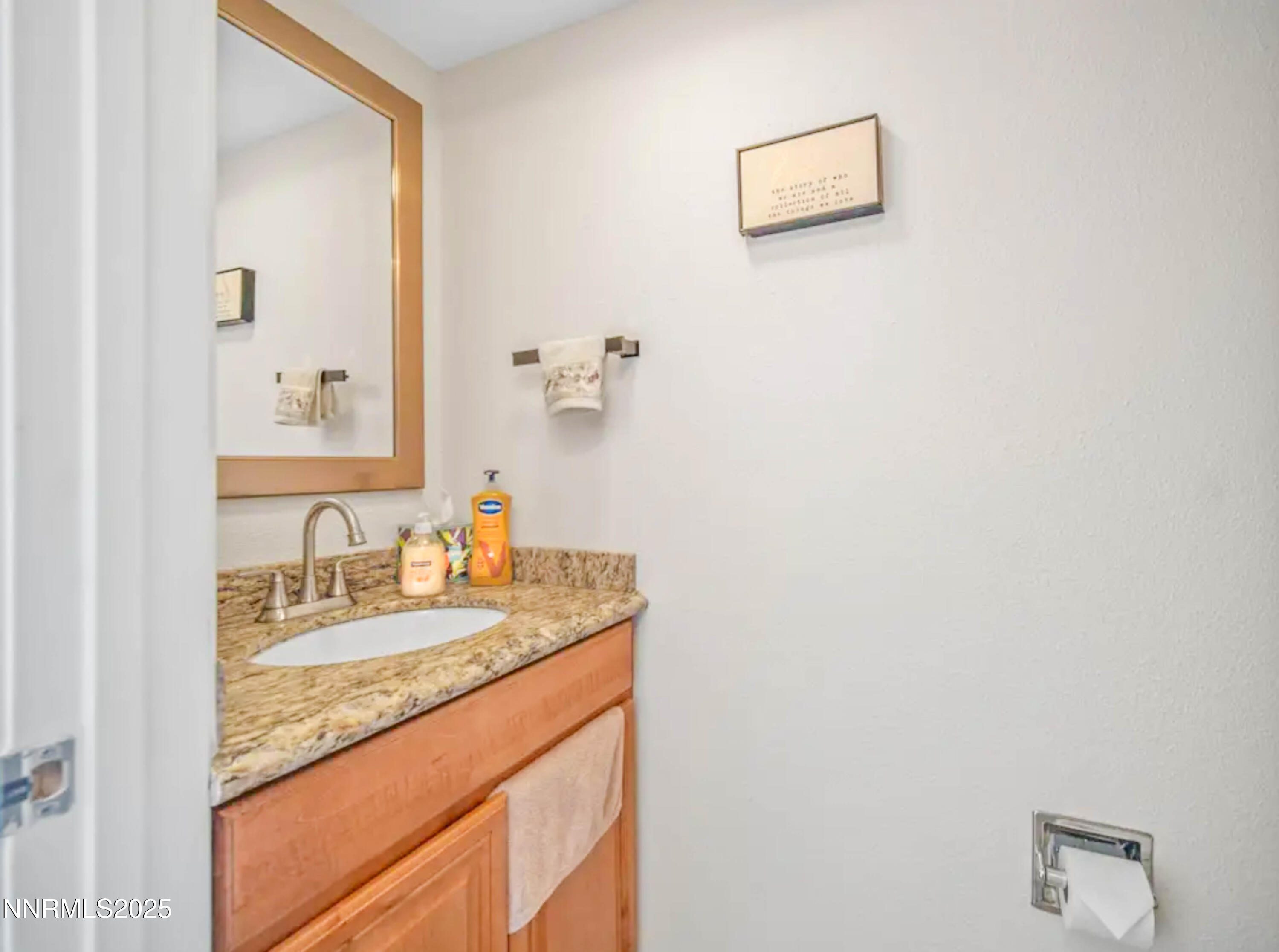 2168 Cannonball Road Sparks, NV 89431 - Photo 6 of 21 a bathroom with a granite countertop sink and a mirror