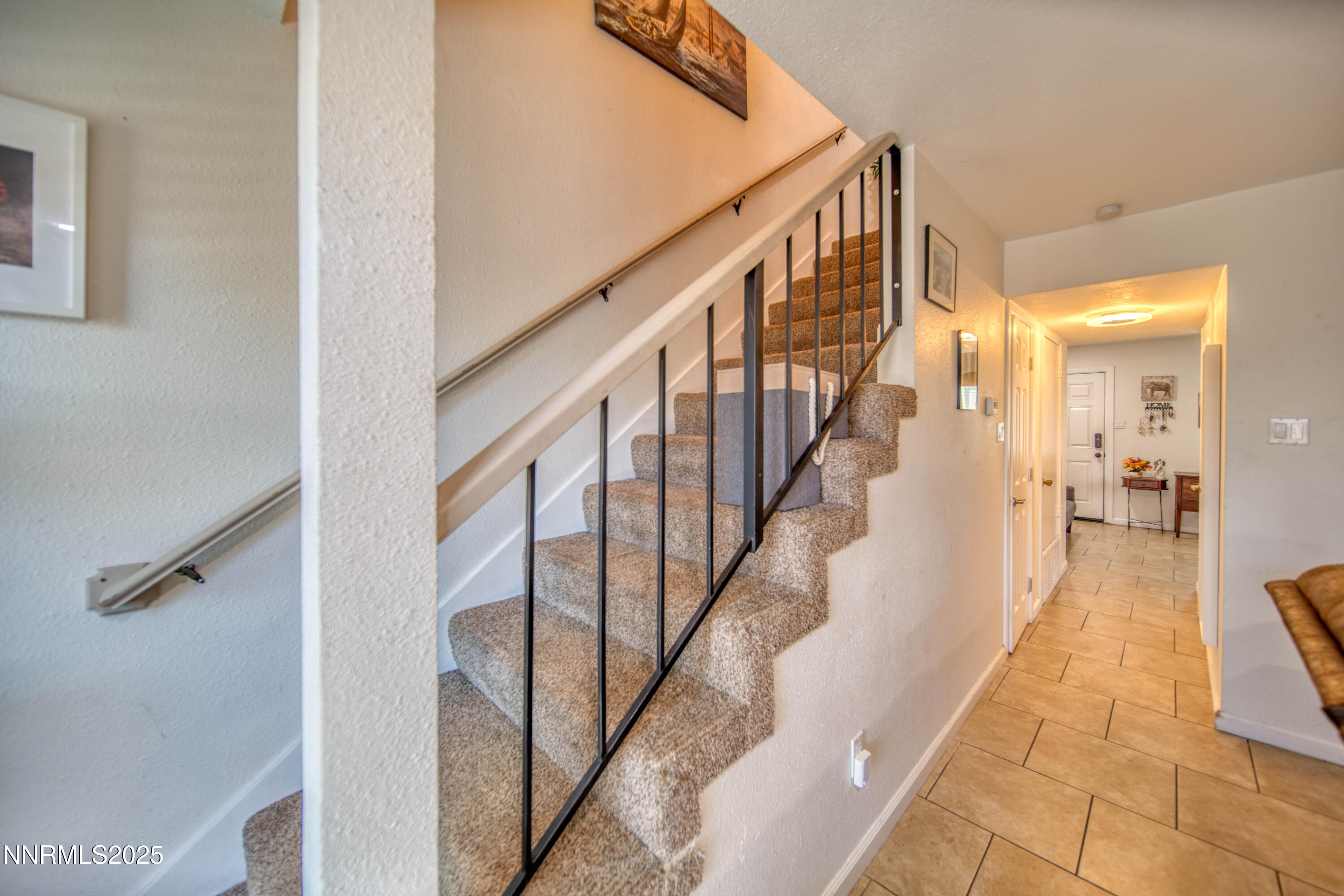 2168 Cannonball Road Sparks, NV 89431 - Photo 7 of 21 a view of a hallway with wooden floor and staircase