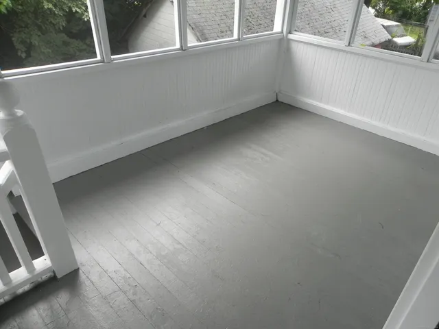 a view of an empty room and window