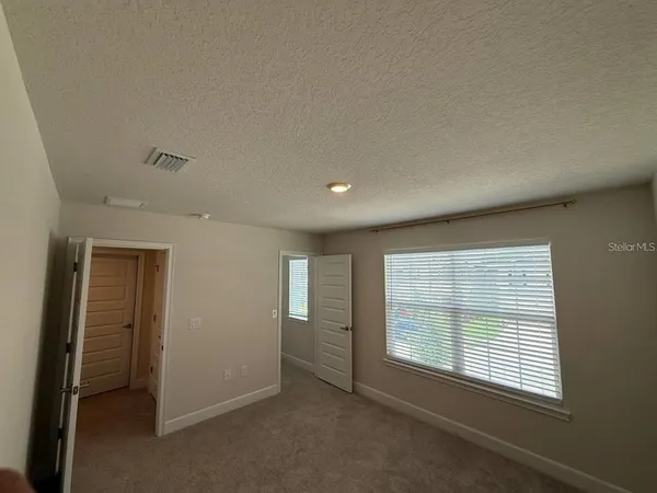 an empty room with an entryway