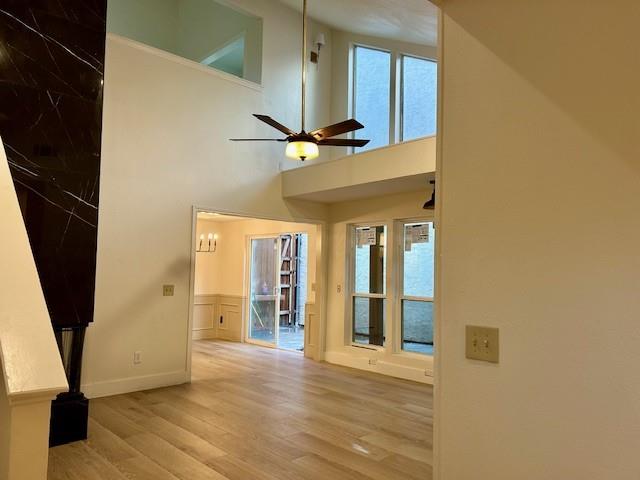 17119 Upper Bay Road Addison, TX 75001 - Photo 2 of 29 a view of a hallway with wooden floor and a cabinet