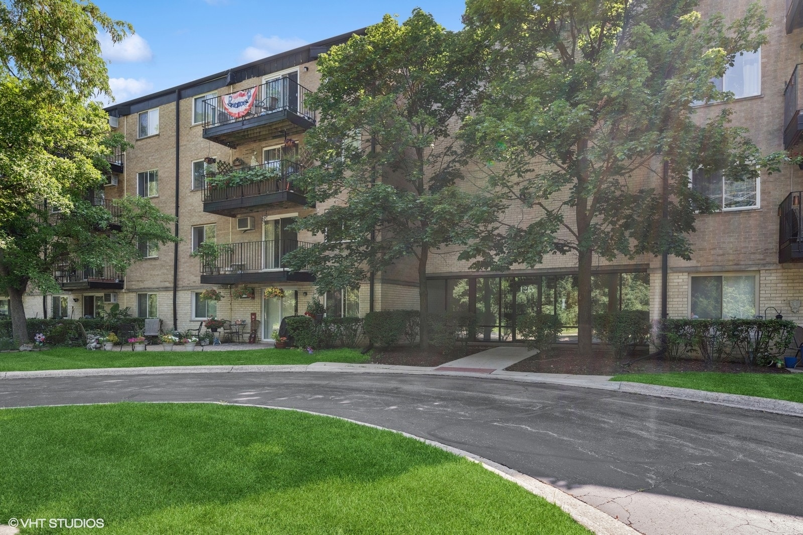 1215 North Waterman Avenue, Unit 3L Arlington Heights, IL 60004 - Photo 1 of 18 a view of a building with a yard