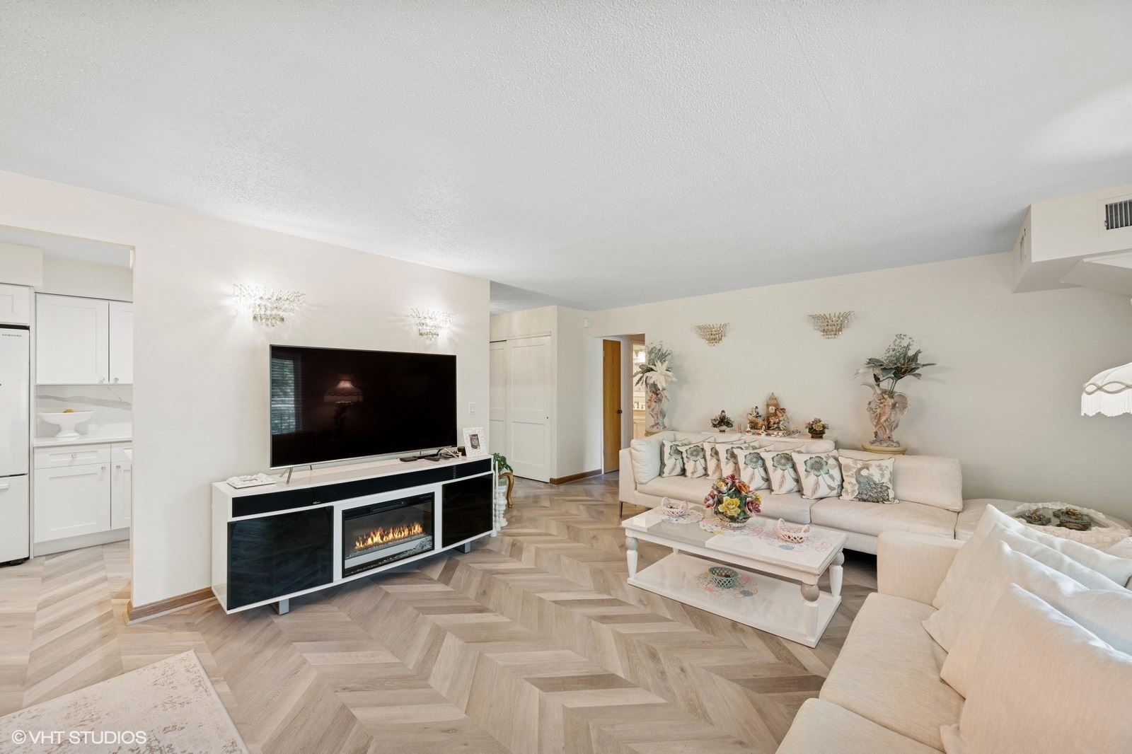 1215 North Waterman Avenue, Unit 3L Arlington Heights, IL 60004 - Photo 6 of 18 a spacious bedroom with a bed and a flat screen tv