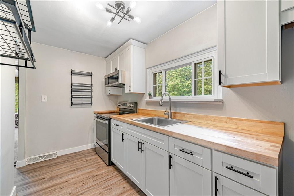 134 Story Road Export, PA 15632 - Photo 11 of 23 a kitchen with a sink cabinets and window