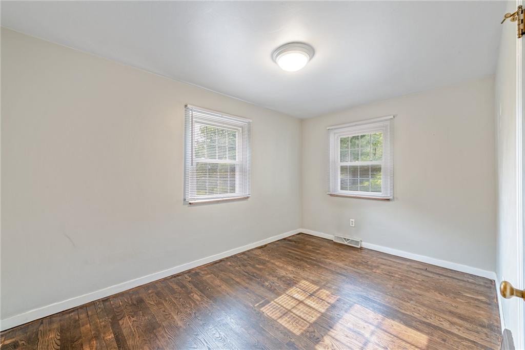134 Story Road Export, PA 15632 - Photo 16 of 23 an empty room with wooden floor and windows