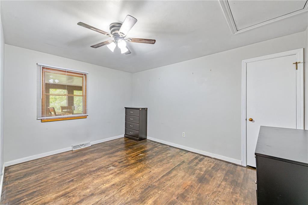 134 Story Road Export, PA 15632 - Photo 18 of 23 a view of a livingroom with a ceiling fan and wooden floor