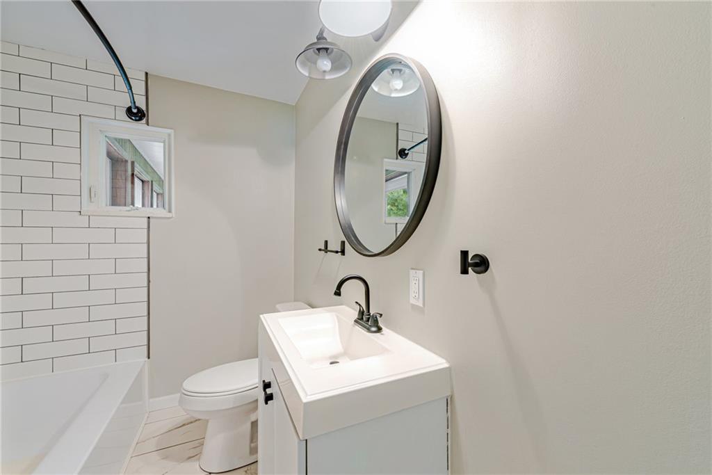 134 Story Road Export, PA 15632 - Photo 20 of 23 a bathroom with a toilet sink and mirror