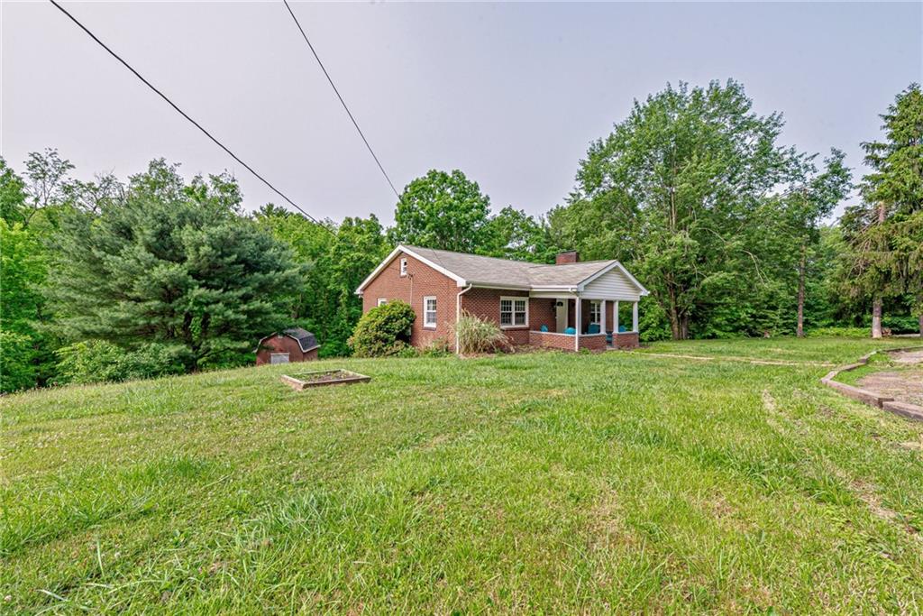 134 Story Road Export, PA 15632 - Photo 3 of 23 a front view of a house with yard and green space