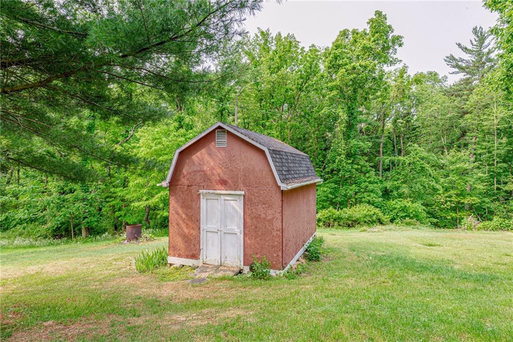 134 Story Road Export, PA 15632 - Photo 5 of 23 a backyard of a house with plants and large tree