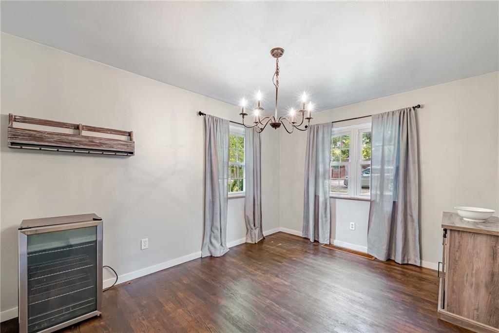 134 Story Road Export, PA 15632 - Photo 8 of 23 a view of a hallway with wooden floor and chandelier