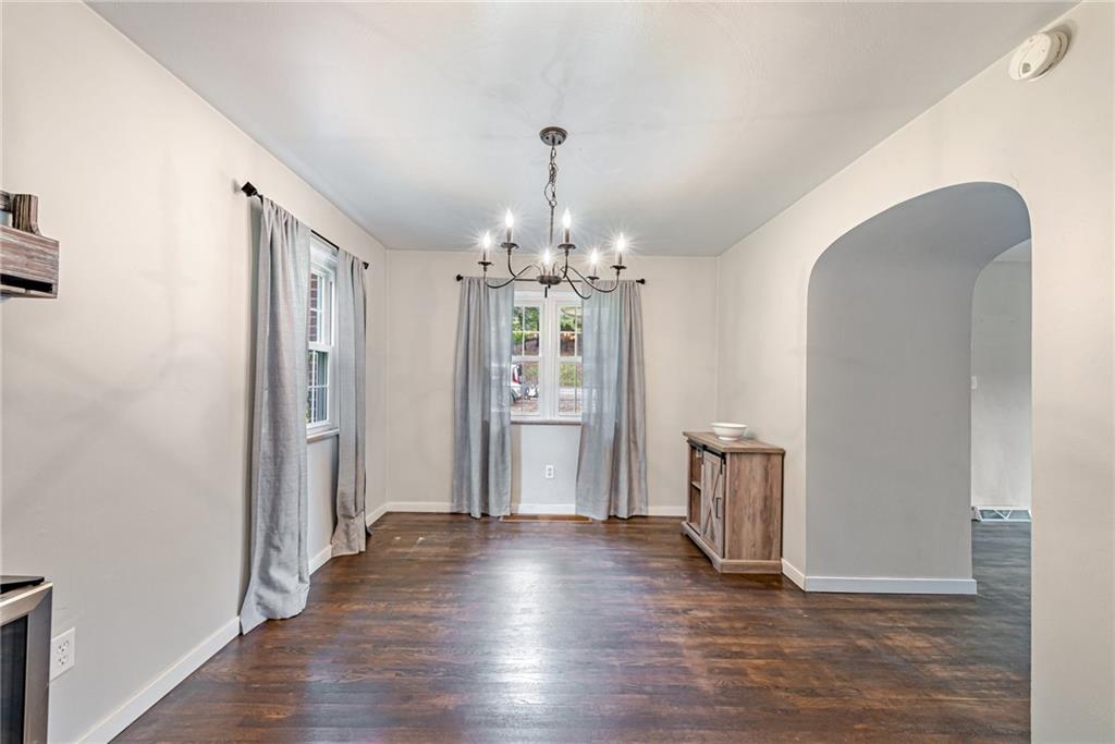 134 Story Road Export, PA 15632 - Photo 10 of 23 a view of a hallway with wooden floor and chandelier