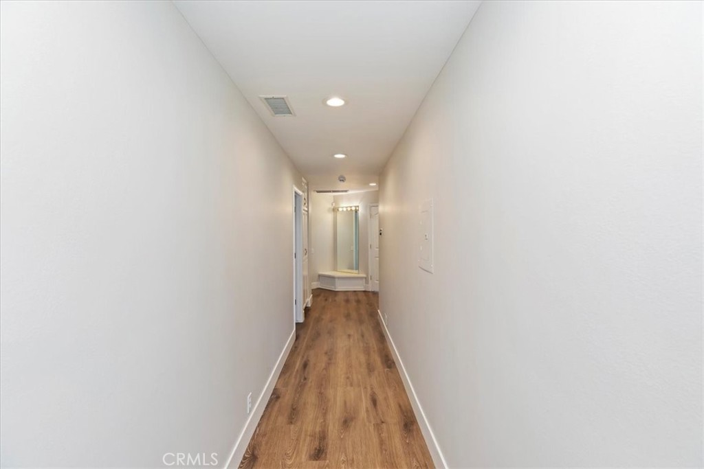 1507 Weston Way Riverside, CA 92506 - Photo 31 of 55 a view of a hallway with wooden floor