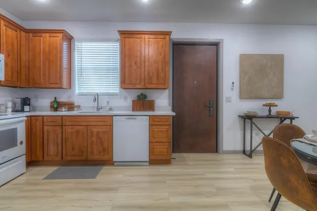 a kitchen with a sink cabinets and window