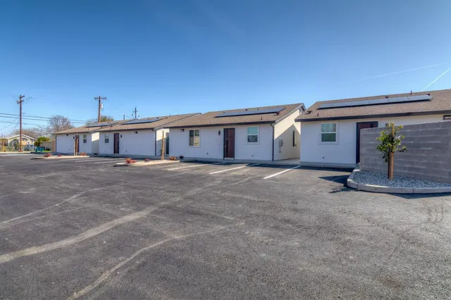 a view of house with garage and glass door
