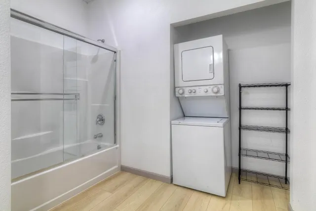 a kitchen with stainless steel appliances granite countertop a sink and a stove