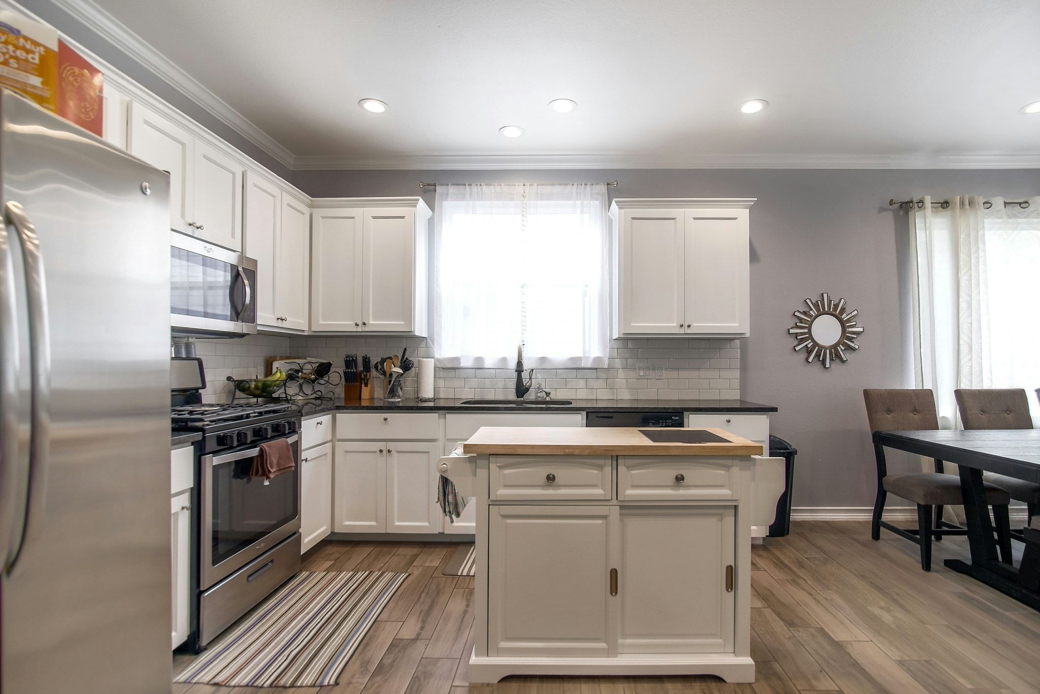 2109 Maxwell Lane, Unit A Austin, TX 78741 - Photo 11 of 27 a kitchen with a stove a sink and a refrigerator