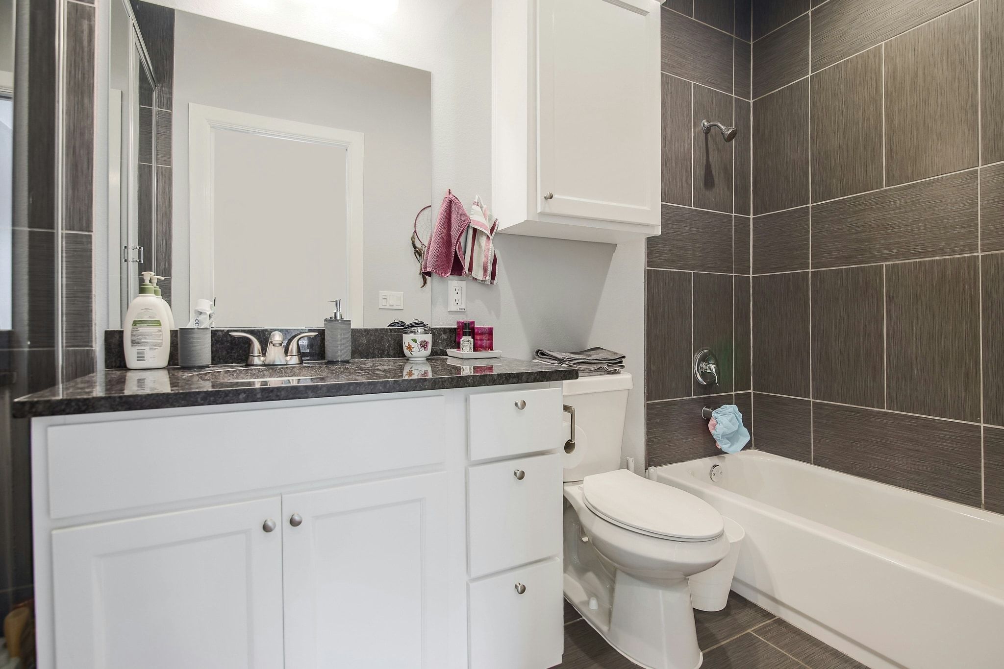 2109 Maxwell Lane, Unit A Austin, TX 78741 - Photo 22 of 27 a bathroom with a sink toilet vanity and tub