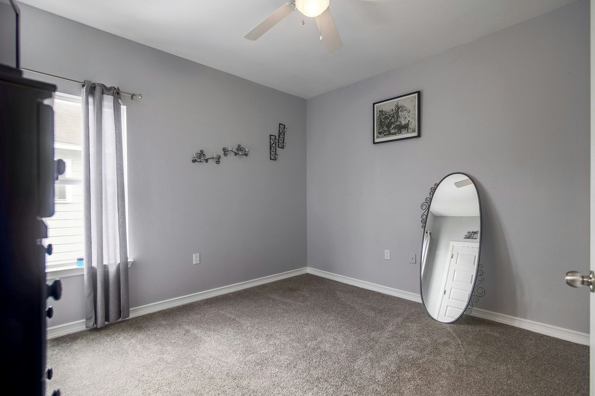2109 Maxwell Lane, Unit A Austin, TX 78741 - Photo 23 of 27 an empty room with windows and closet