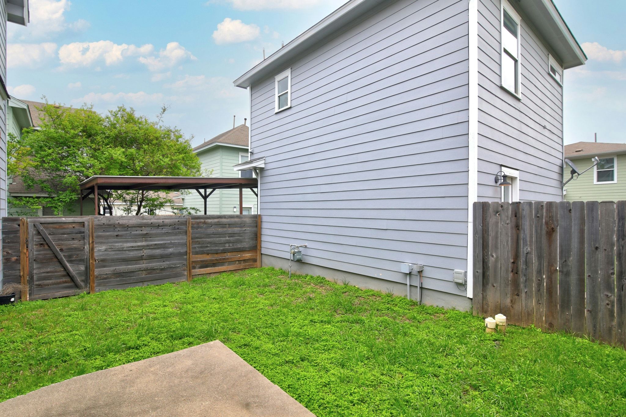 2109 Maxwell Lane, Unit A Austin, TX 78741 - Photo 25 of 27 a view of a back yard of the house with a wooden fence