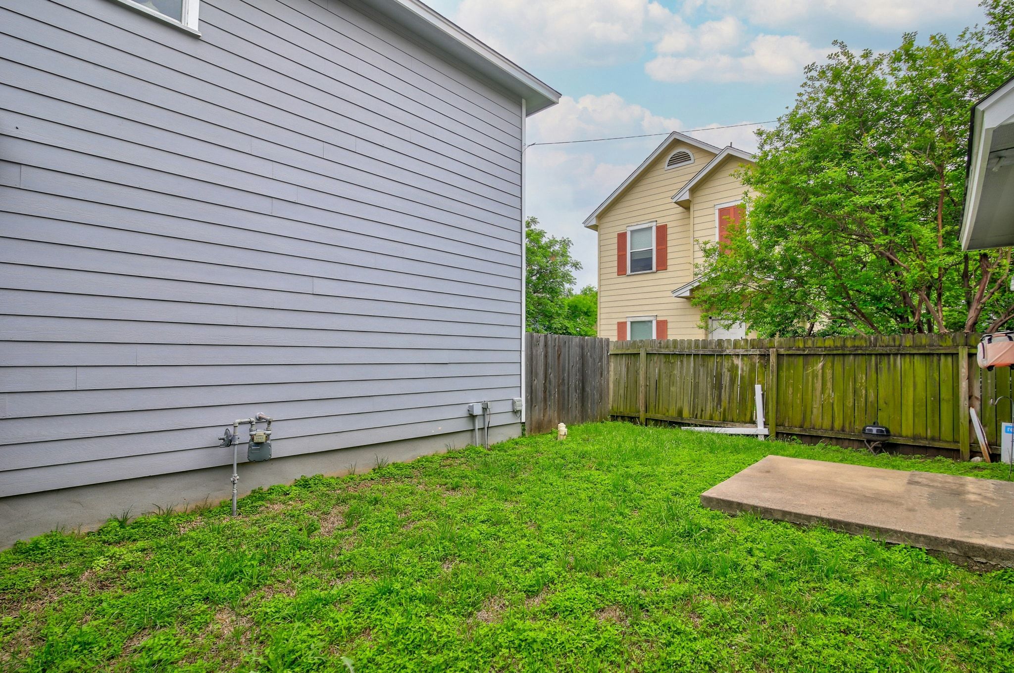 2109 Maxwell Lane, Unit A Austin, TX 78741 - Photo 26 of 27 a view of a backyard with a garden