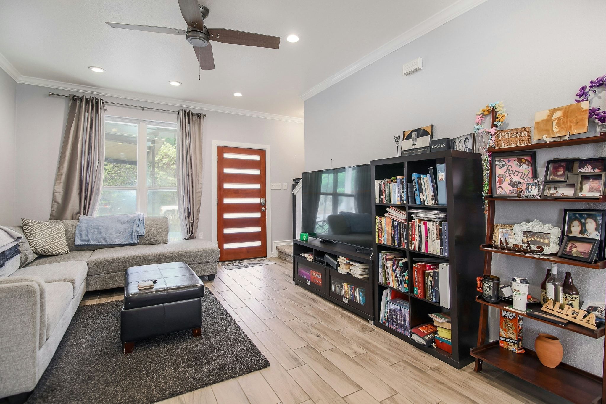2109 Maxwell Lane, Unit A Austin, TX 78741 - Photo 7 of 27 a living room with furniture and a book shelf