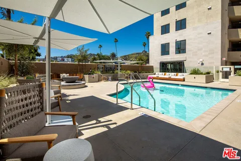 a outdoor space with lots of tables and chairs
