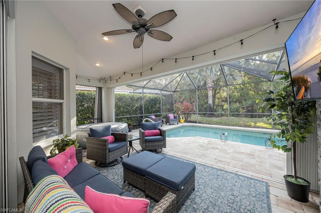 20350 Talon Trace Estero, FL 33928 - Photo 20 of 24 Swimming pool featuring an outdoor lounge area, a patio area, a sunroom, and glass enclosure