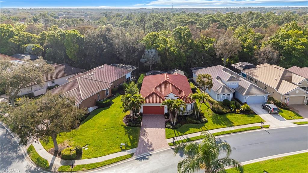 20350 Talon Trace Estero, FL 33928 - Photo 2 of 24 Aerial perspective of suburban area featuring a heavily wooded area