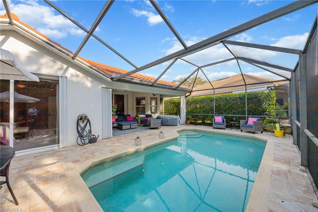 20350 Talon Trace Estero, FL 33928 - Photo 23 of 24 Outdoor pool with a sunroom, a patio, glass enclosure, and outdoor lounge area