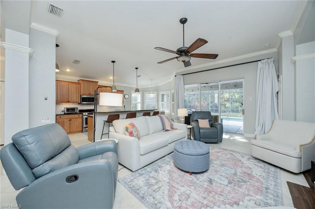 20350 Talon Trace Estero, FL 33928 - Photo 7 of 24 Living area with ornamental molding and ceiling fan