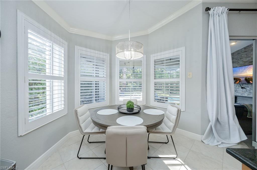 20350 Talon Trace Estero, FL 33928 - Photo 9 of 24 Dining room featuring crown molding