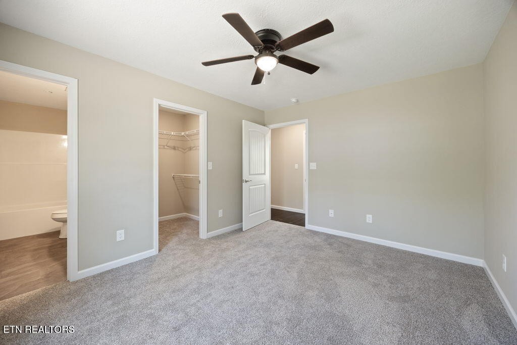 503 Hillcrest Street Clinton, TN 37716 - Photo 8 of 19 an empty room with closet and ceiling fan