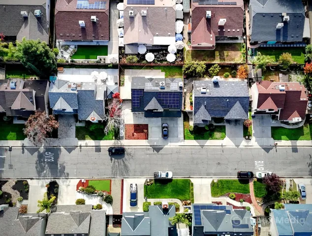 an aerial view of houses with outdoor space