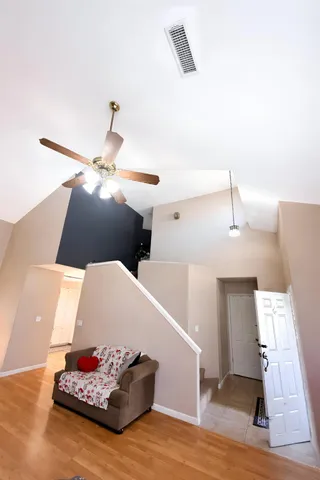 a living room with furniture and white walls