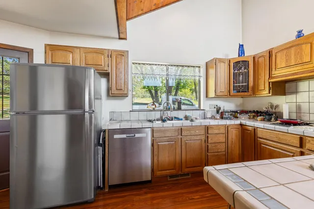 a bedroom with furniture window and wooden floor