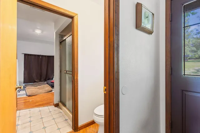 a kitchen with a refrigerator a stove top oven a sink and cabinets