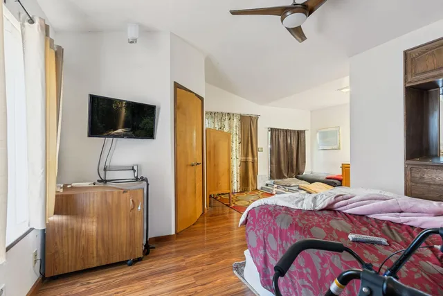 a view of a livingroom with furniture and a window