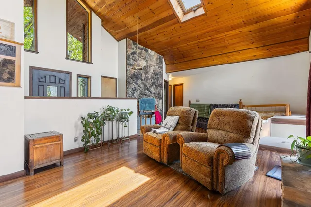a balcony with trees in front of it