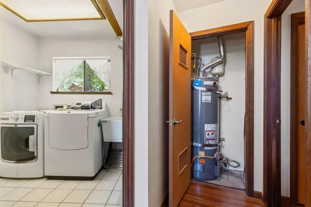 a balcony with wooden floor and trees in the back