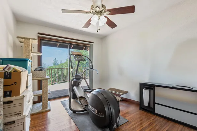 a view of yard with swimming pool and green space