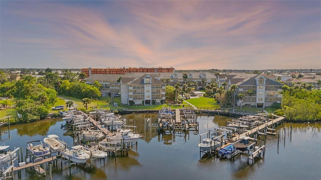 5567 Sea Forest Drive, Unit 323 New Port Richey, FL 34652 - Photo 1 of 37 a view of a lake with a mountain in the back