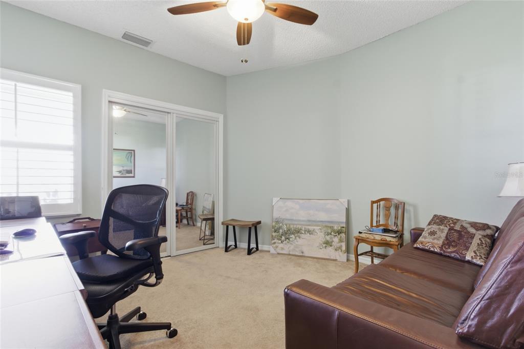 5567 Sea Forest Drive, Unit 323 New Port Richey, FL 34652 - Photo 19 of 37 a living room with furniture