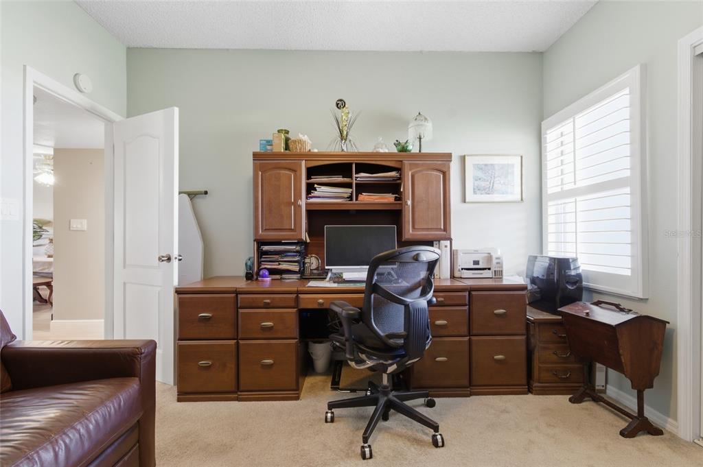 5567 Sea Forest Drive, Unit 323 New Port Richey, FL 34652 - Photo 20 of 37 a view of a workspace with furniture and a window