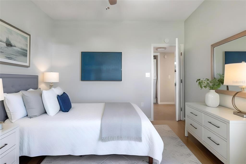 5567 Sea Forest Drive, Unit 323 New Port Richey, FL 34652 - Photo 21 of 37 a bedroom with a bed and a couch
