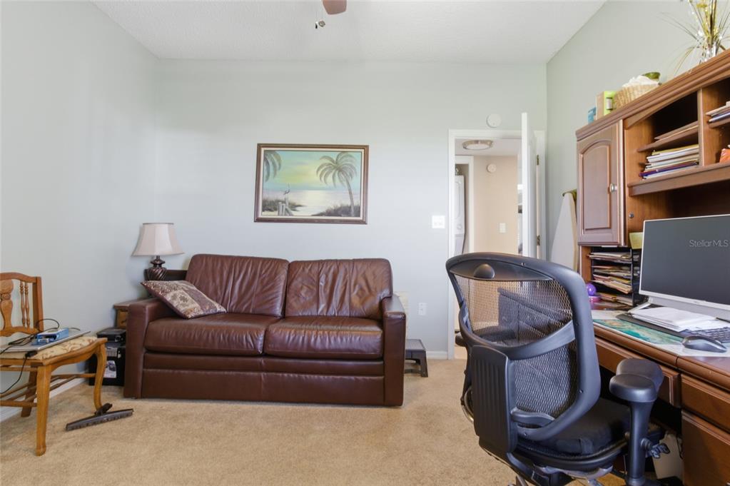 5567 Sea Forest Drive, Unit 323 New Port Richey, FL 34652 - Photo 23 of 37 a living room with furniture and a window