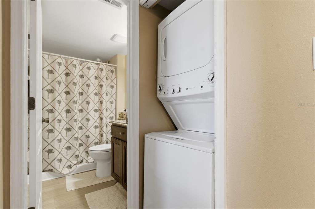 5567 Sea Forest Drive, Unit 323 New Port Richey, FL 34652 - Photo 24 of 37 a utility room with dryer and washer
