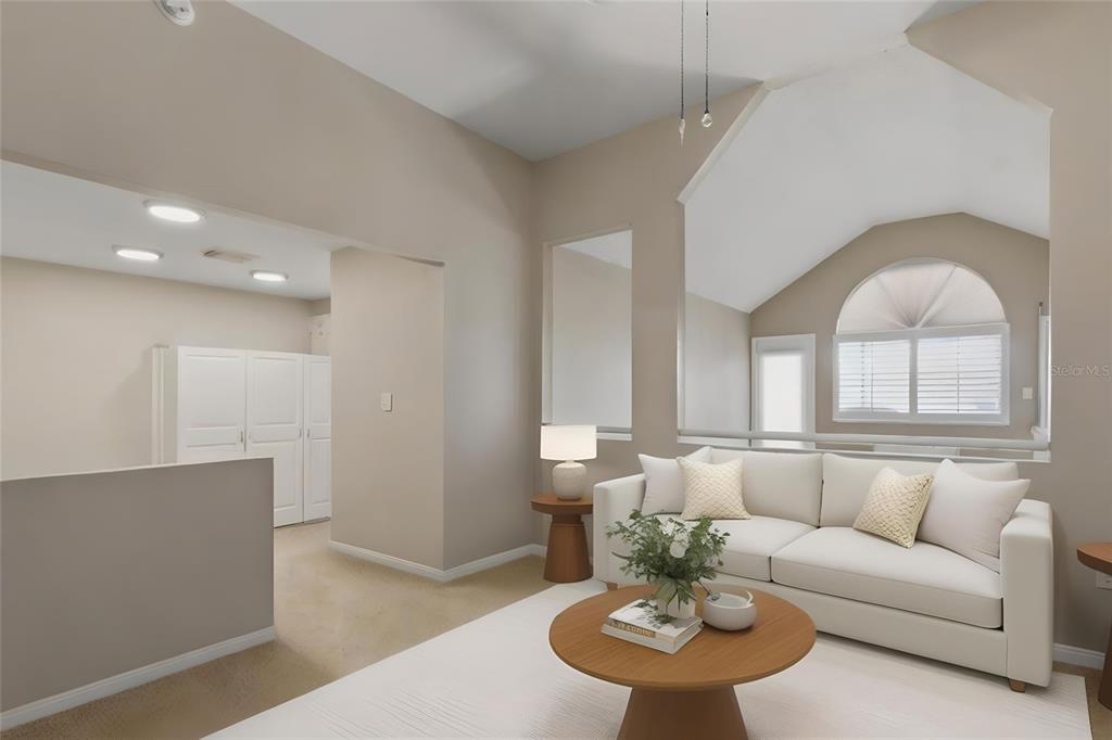 5567 Sea Forest Drive, Unit 323 New Port Richey, FL 34652 - Photo 28 of 37 a living room with furniture and a dining table with kitchen