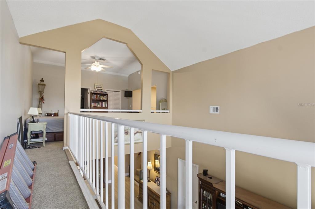 5567 Sea Forest Drive, Unit 323 New Port Richey, FL 34652 - Photo 30 of 37 a view of a livingroom with furniture and staircase