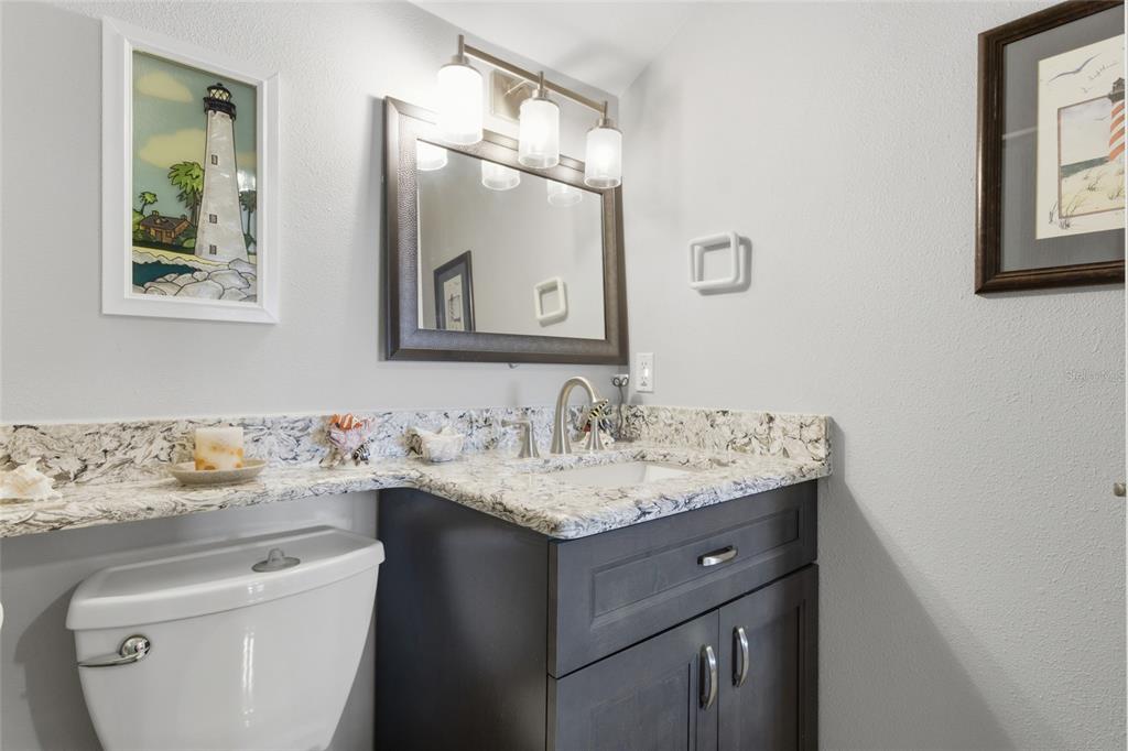 5567 Sea Forest Drive, Unit 323 New Port Richey, FL 34652 - Photo 32 of 37 a bathroom with a sink and a toilet
