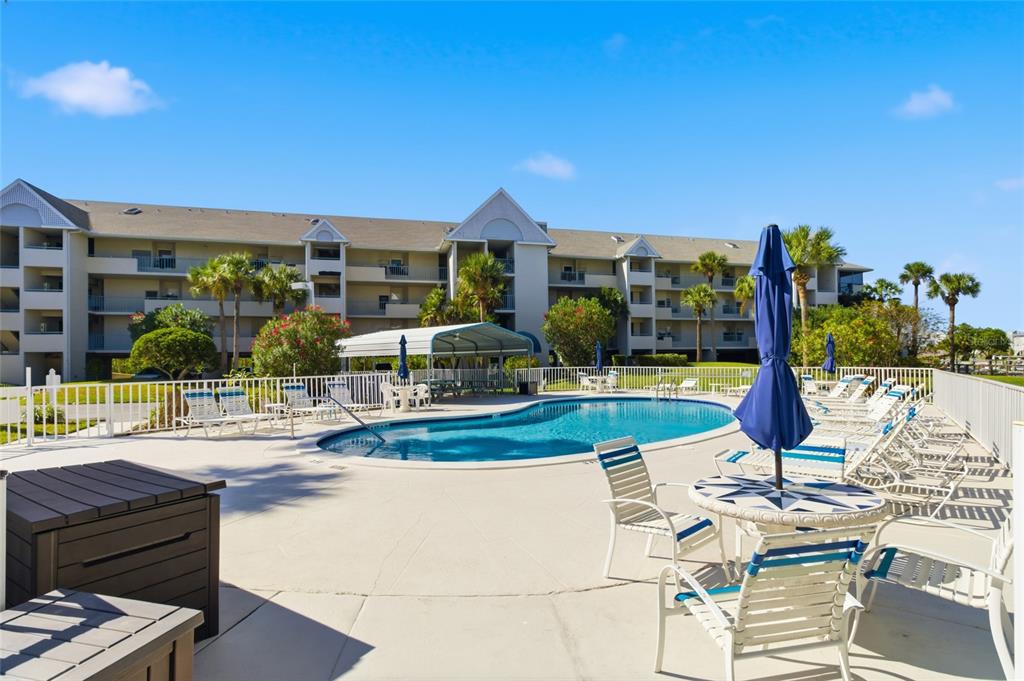 5567 Sea Forest Drive, Unit 323 New Port Richey, FL 34652 - Photo 34 of 37 a view of a patio with swimming pool